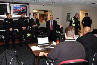 Senators Coons and Blunt deliver home-made cookies to Capitol Police Headquarters in December 2013.
