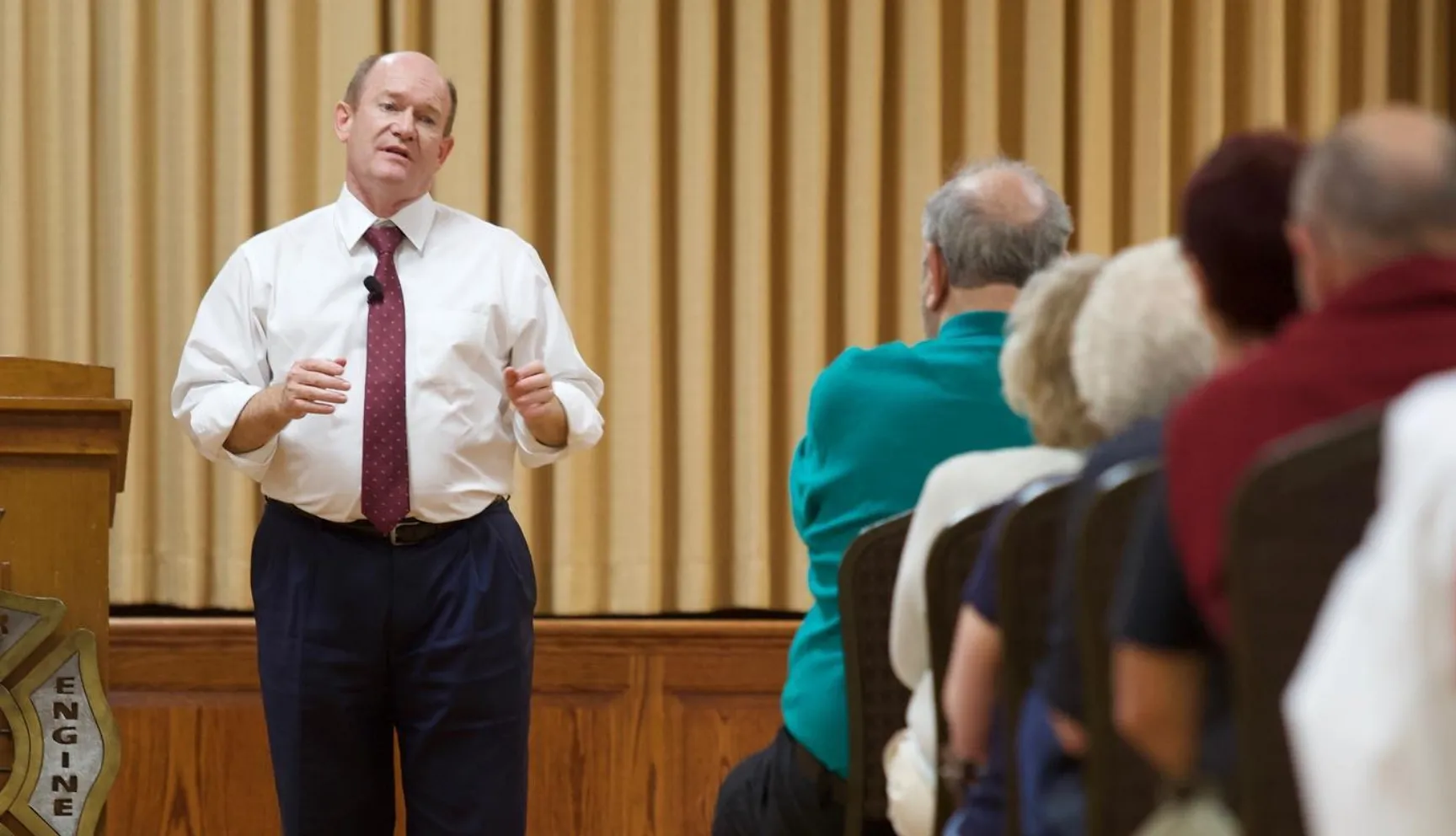 Coons talking with constituents