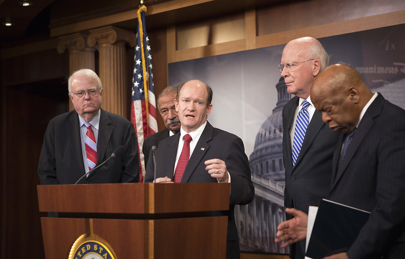 Senator Coons speaks at a press conference on Capitol Hill on Thursday with (l-r) Congressman Jim Sensenbrenner (R-Wis.), Congressman John Conyers (D-Mich.), Senator Patrick Leahy (D-Vt.) and Congressman John Lewis (D-Ala.).