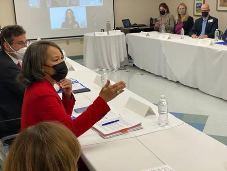 A picture containing text, person, indoor, peopleDescription automatically generated