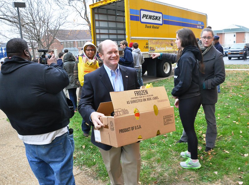 Senator Coons lends a hand at the 31st Annural Norman Oliver Thanksgiving Turkey Drive in Wilmington on November 26, 2013. 