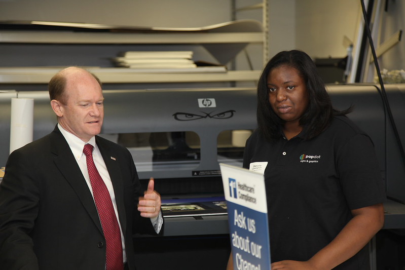 Sen. Coons and Danielle of PopDot tour PopDot's facilities 