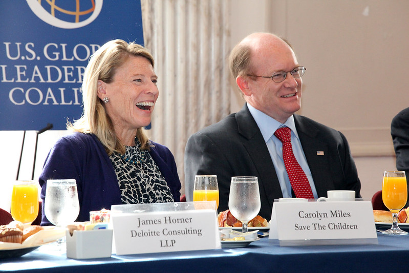 Senator Coons shares a laugh with Carolyn Miles of Feed the Children at a breakfast hosted by the U.S. Global Leadership Coalition
