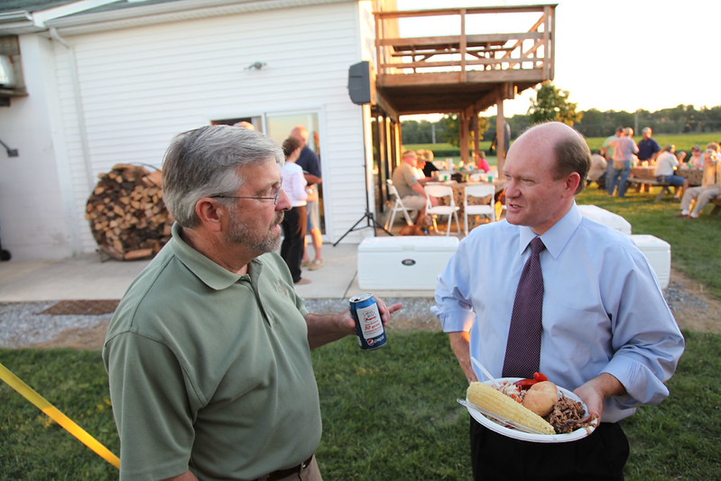 U.S. Senator Chris Coons joins Ducks Unlimited leaders for a BBQ dinner in Dover on September 4, 2013.